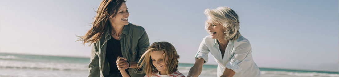 Three generations of family on the beach